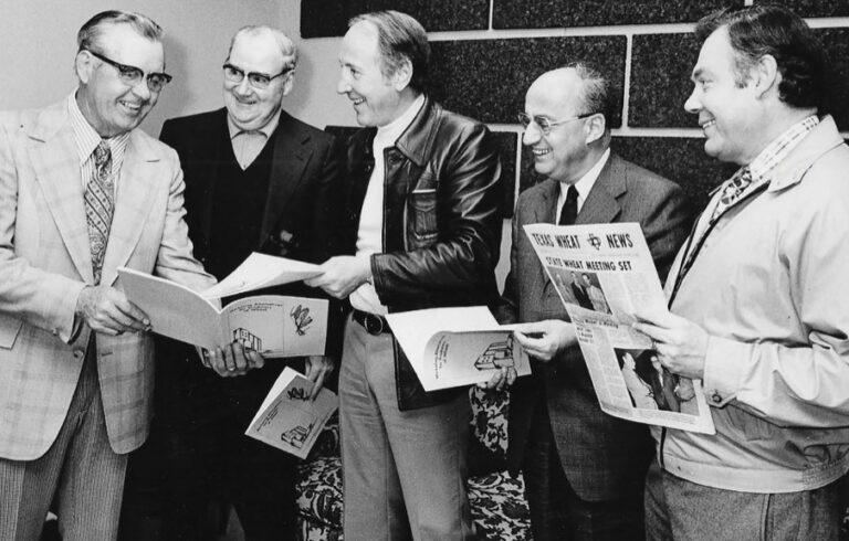 Early TWPA leaders with copies of Producers News.